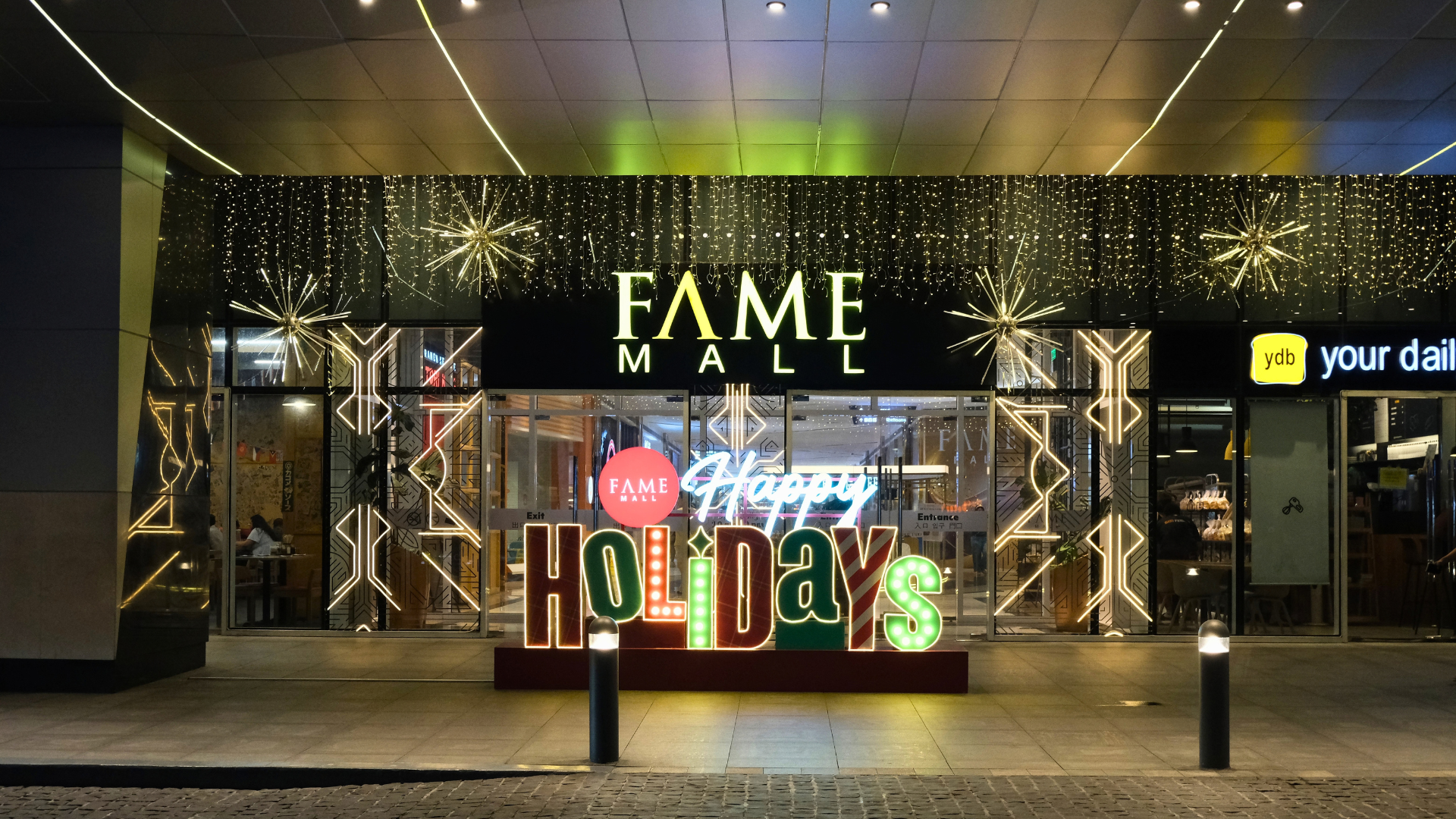 Fame Mall neon storefront entrance at night